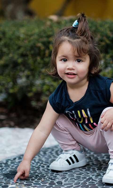 Girl pointing at ant