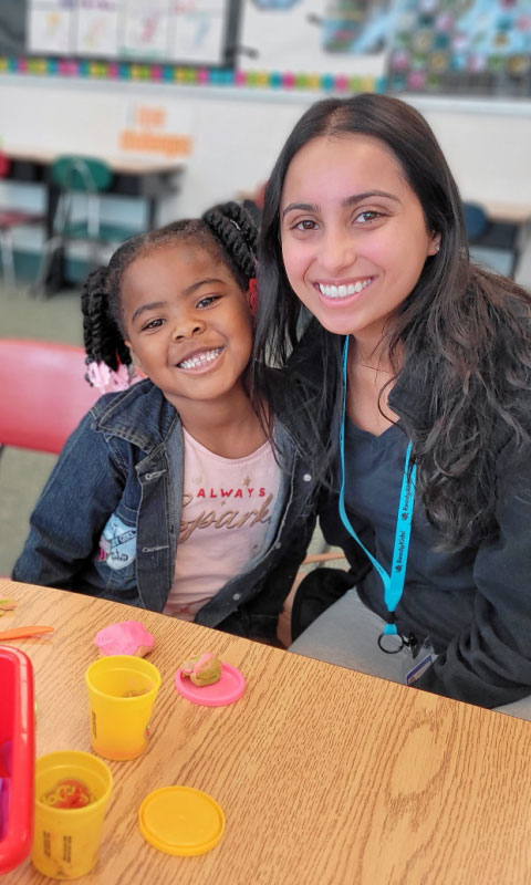 ReadingPals volunteer with child