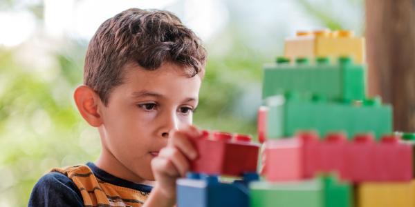 Child with building blocks