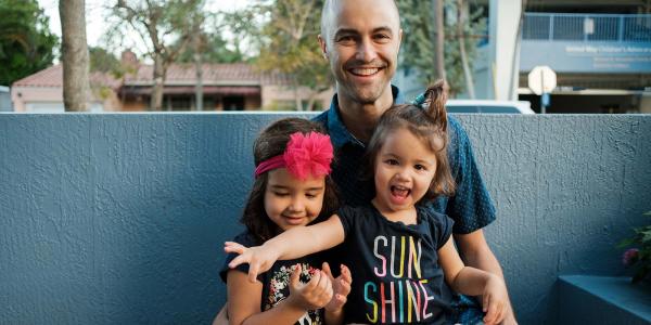 Father with children. Image courtesy Christina Frigo