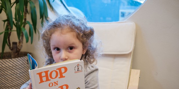 Girl reading Hop on Pop