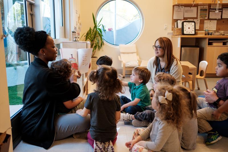 Educator reading to children