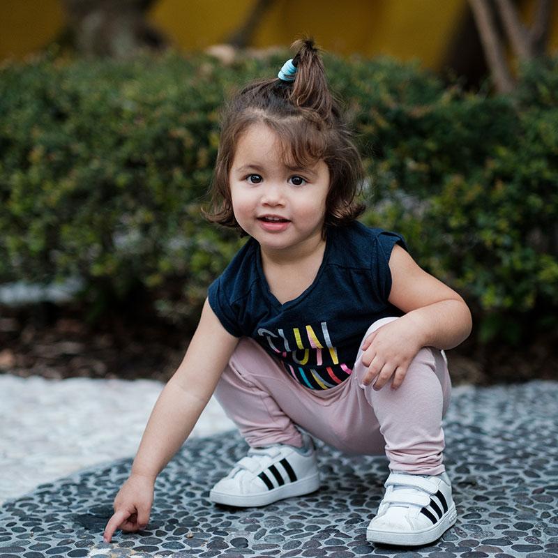 Girl Pointing at and and looking up