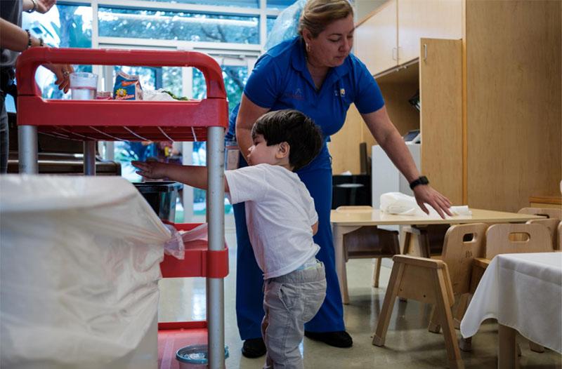 Kids cleaning up after food