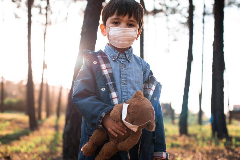 Portrait of kid wearing safety mask